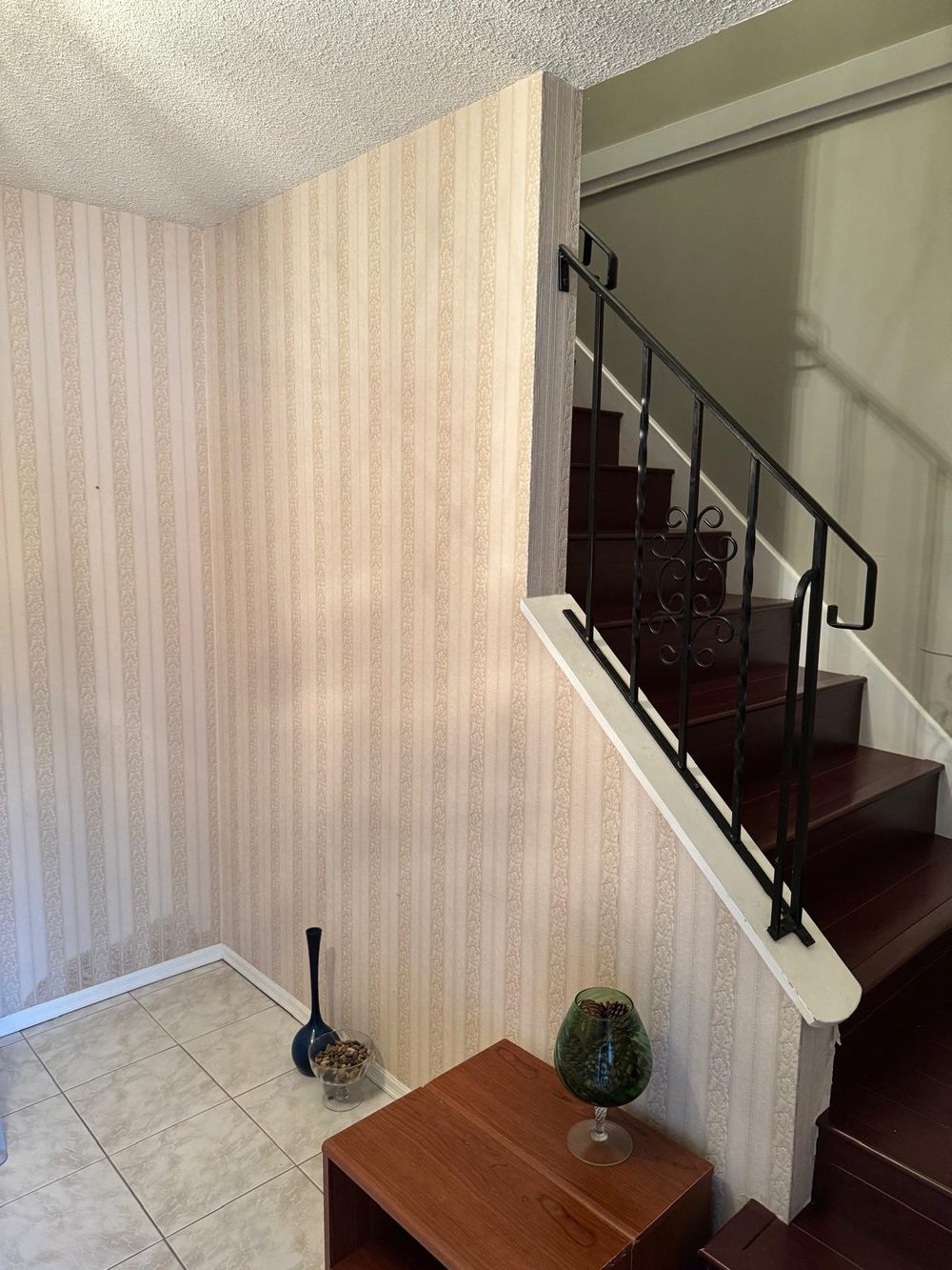 Stairwell before: striped wallpaper