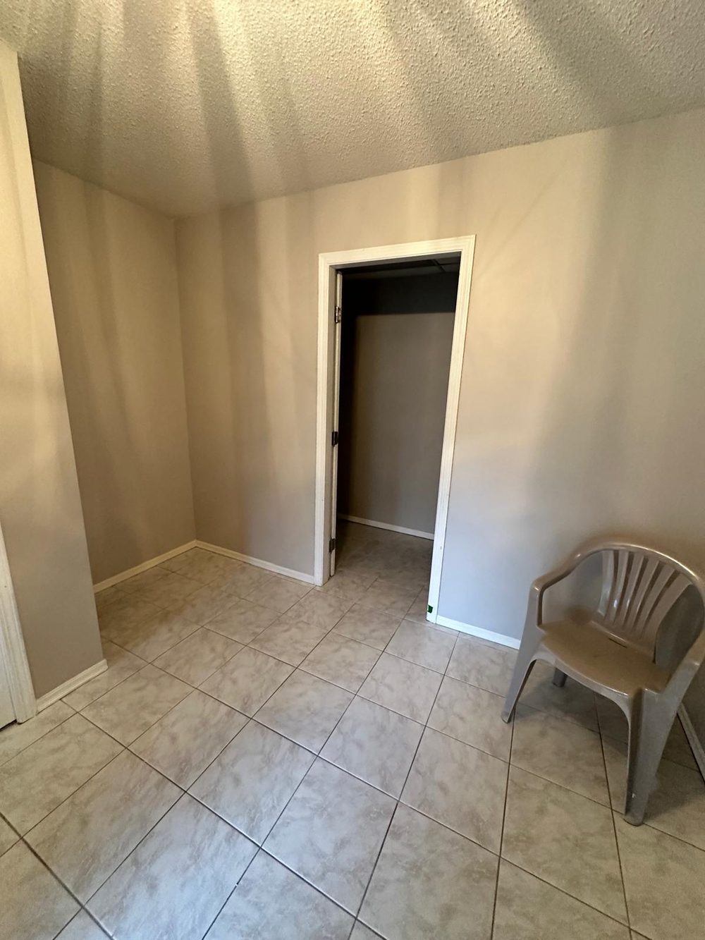 The same entry hallway painted a smooth neutral colour