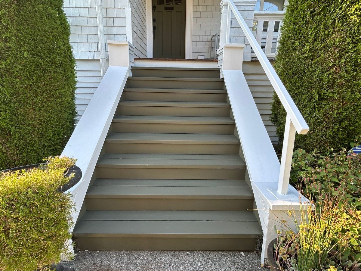 Freshly painted front steps and railing